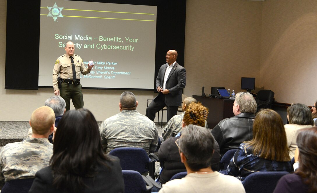 Los Angeles County Sheriff's Department Commander Mike Parker (left) and Detective Tony Moore speak at the Airmen and Family Readiness Center Dec. 1 about social media security. (U.S. Air Force photo by Christopher Ball)