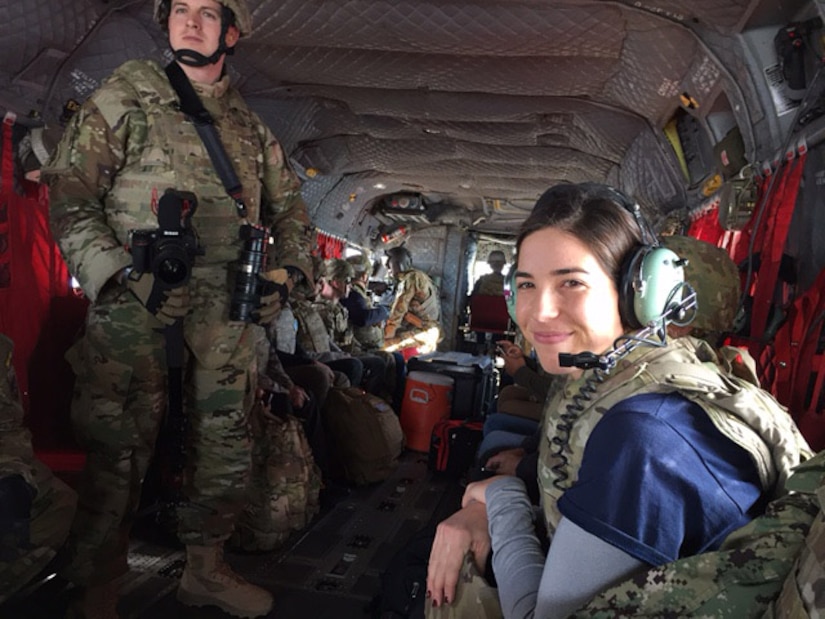 Olympic gold medalist Maya DiRado rides in a CH-47 helicopter to Forward Operating Base Gamberi, Afghanistan, as part of the 2016 Holiday USO Tour, Dec. 7, 2016. DoD photo by Jim Garamone