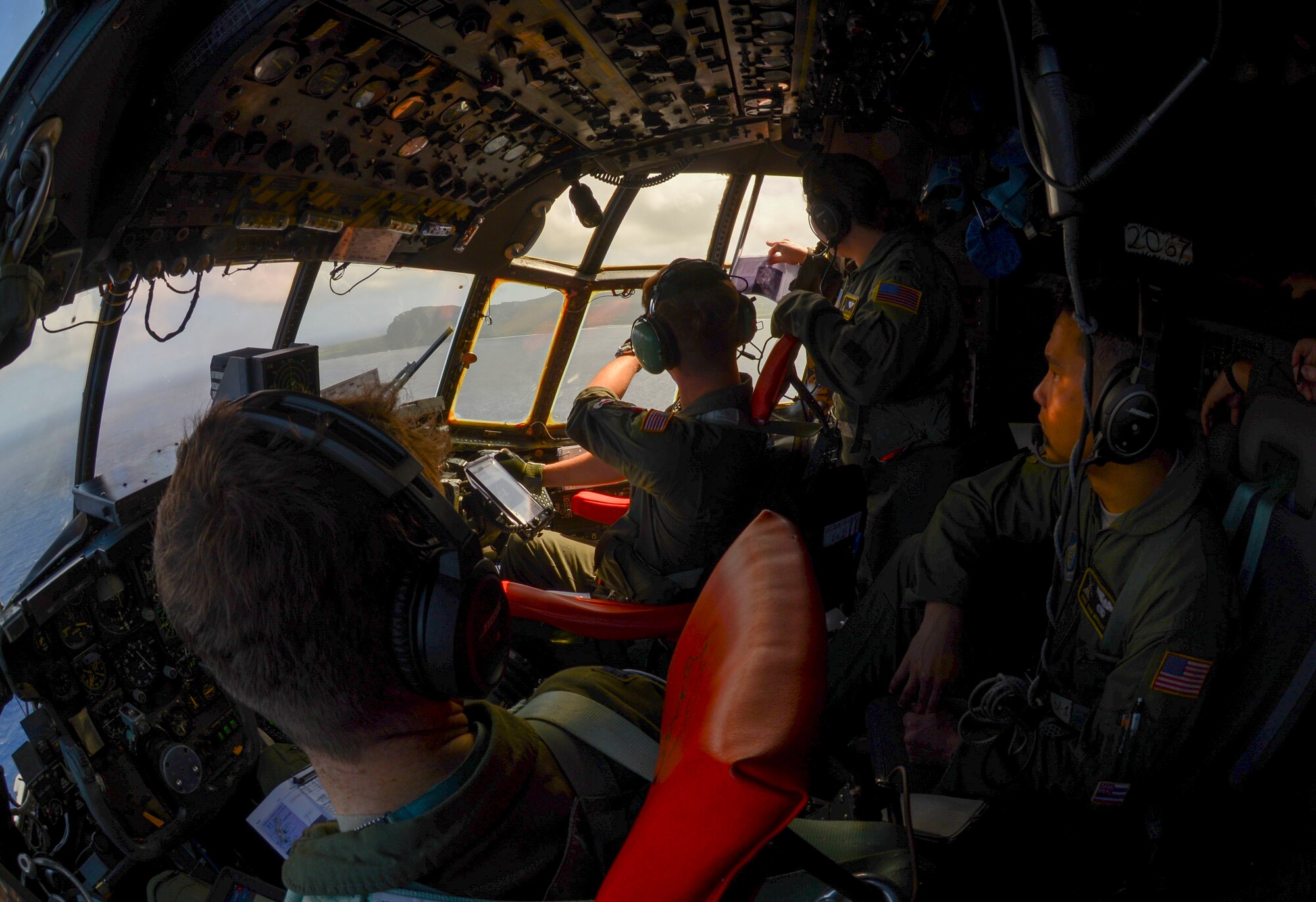 Air Crew aboard a C-130 H assigned to the 36th Airlift Squadron circle a Micronesian Island Dec. 5, 2016. The crew were practicing air drop procedures during Operation Christmas Drop. Each year OCD 
provides aid to over 30,000 islanders in Chuuk, Palau, Yap, Marshall Islands and Commonwealth of the Northern Mariana Islands. (U.S. Air Force photo by Senior Airman Elizabeth Baker/Released)