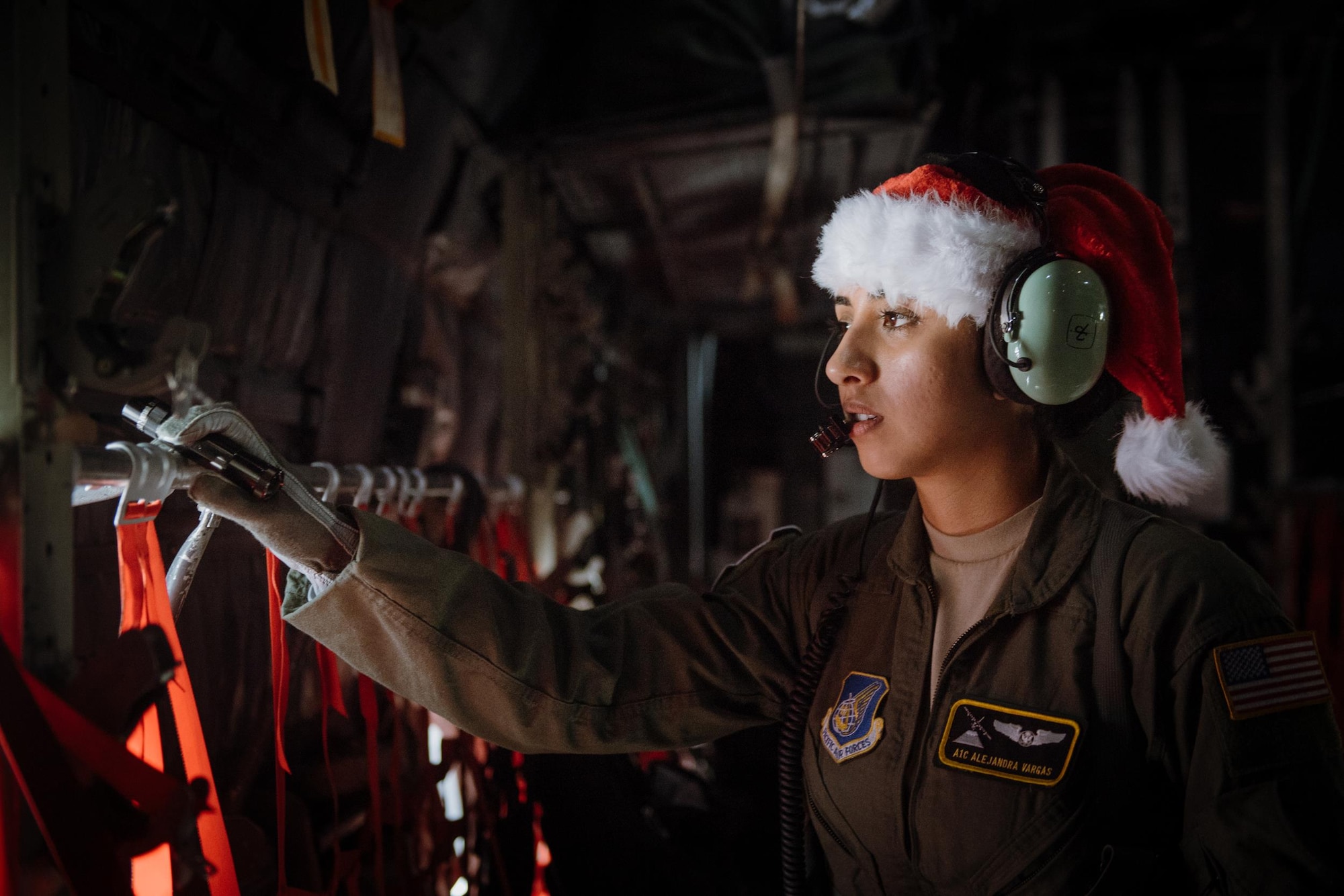 Airman 1st Class Alejandra Vargas, 36th Airlift Squadron C-130 Hercules loadmaster, performs preflight inspections during Operation Christmas Drop at Andersen Air Force Base, Guam, Dec. 5, 2016. Operation Christmas Drop is a training mission which helps the 374th Airlift Wing, Yokota AB, Japan, along with Japan Air Self-Defense Force and Royal Australian Air Force, to maintain and develop combat readiness through sustainable aircraft generation/recovery while practicing low-cost, low-altitude airdrops. (U.S. Air Force photo by Senior Airman Delano Scott/Released)