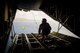 Airman 1st Class Alejandra Vargas, 36th Airlift Squadron C-130 Hercules loadmaster, pushes a bundle during Operation Christmas Drop at Andersen Air Force Base, Guam, Dec. 5, 2016. Australian and Japanese aircrews joined U.S. Airmen to execute the Humanitarian Aid/Disaster Relief training event where C-130 aircrews perform low-cost, low-altitude airdrops to drop zones while providing critical supplies to 56 islands. (U.S. Air Force photo by Senior Airman Delano Scott/Released)