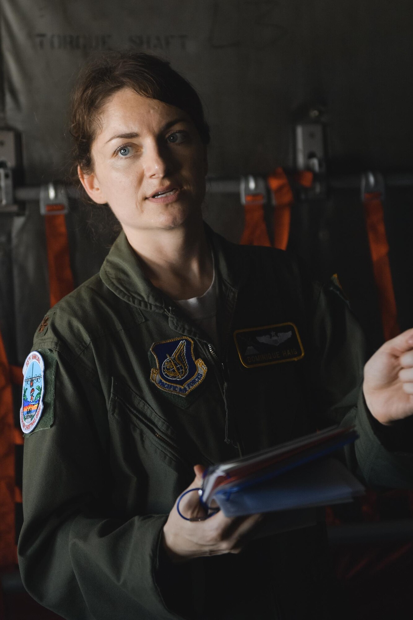 Maj. Dominique Haig, 36th Airlift Squadron C-130 Hercules pilot, briefs crewmembers during Operation Christmas Drop 2016 at Andersen Air Force Base, Guam, Dec. 6, 2016. This year marks 65 years of Operation Christmas Drop which provides joint airlift training opportunities for both peace and wartime efforts. (U.S. Air Force photo by Senior Airman Delano Scott/Released)