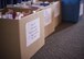 Packages of cookies are placed into boxes, to be distributed to the various base dormitories, for Holloman’s annual Airman Cookie Drive at the Community Activity Center at Holloman Air Force Base, N.M. on Dec 4, 2016. Members of the First Sergeant’s Council distributed the cookies to Airmen living in the base dorms Dec. 5, 2016. (U.S. Air Force photo by Airman 1st Class Alexis P. Docherty) 