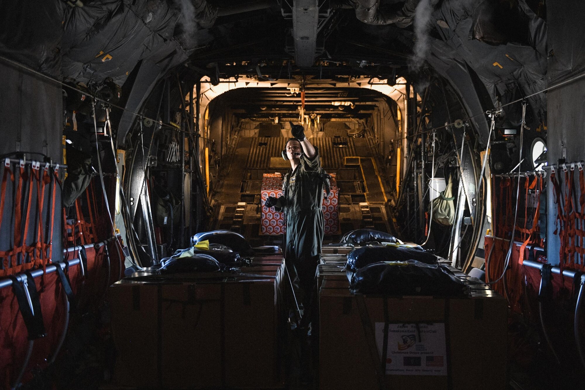 Staff. Sgt. Andrew Thompson, 36th Airlift Squadron C-130 Hercules loadmaster, prepares for takeoff during Operation Christmas Drop 2016 at Andersen Air Force Base, Guam, Dec. 6, 2016. Every December, C-130H Hercules aircrews from Yokota head to Andersen Air Force Base to execute low-cost, low-altitude humanitarian airdrops to islanders throughout the Commonwealth of the Northern Marianas, Federated States of Micronesia, Republic of Palau. (U.S. Air Force photo by Senior Airman Delano Scott/Released)