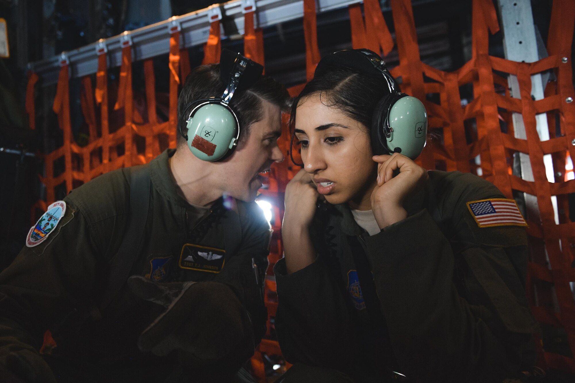 C-130 Hercules loadmasters from Yokota Air Base, Japan, discuss mission details during Operation Christmas Drop 2016 over remote Micronesian islands, Dec. 6, 2016. Every December, C-130H Hercules aircrews from Yokota head to Andersen Air Force Base to execute low-cost, low-altitude humanitarian airdrops to islanders throughout the Commonwealth of the Northern Marianas, Federated States of Micronesia, Republic of Palau. (U.S. Air Force photo by Senior Airman Delano Scott/Released)