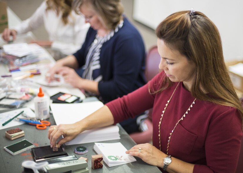 Lisa Cantwell, the Airman Cookie Drive director, crafts a handmade card for Holloman’s annual Airman Cookie Drive at the Community Activity Center at Holloman Air Force Base, N.M. on Dec 5, 2016. Numerous people and organizations supported this year’s cookie drive including, but not limited to, Alamogordo residents, culinary arts students from both Alamogordo Middle School and Alamogordo High School and the First Sergeants Council here. (U.S. Air Force photo by Airman 1st Class Alexis P. Docherty)