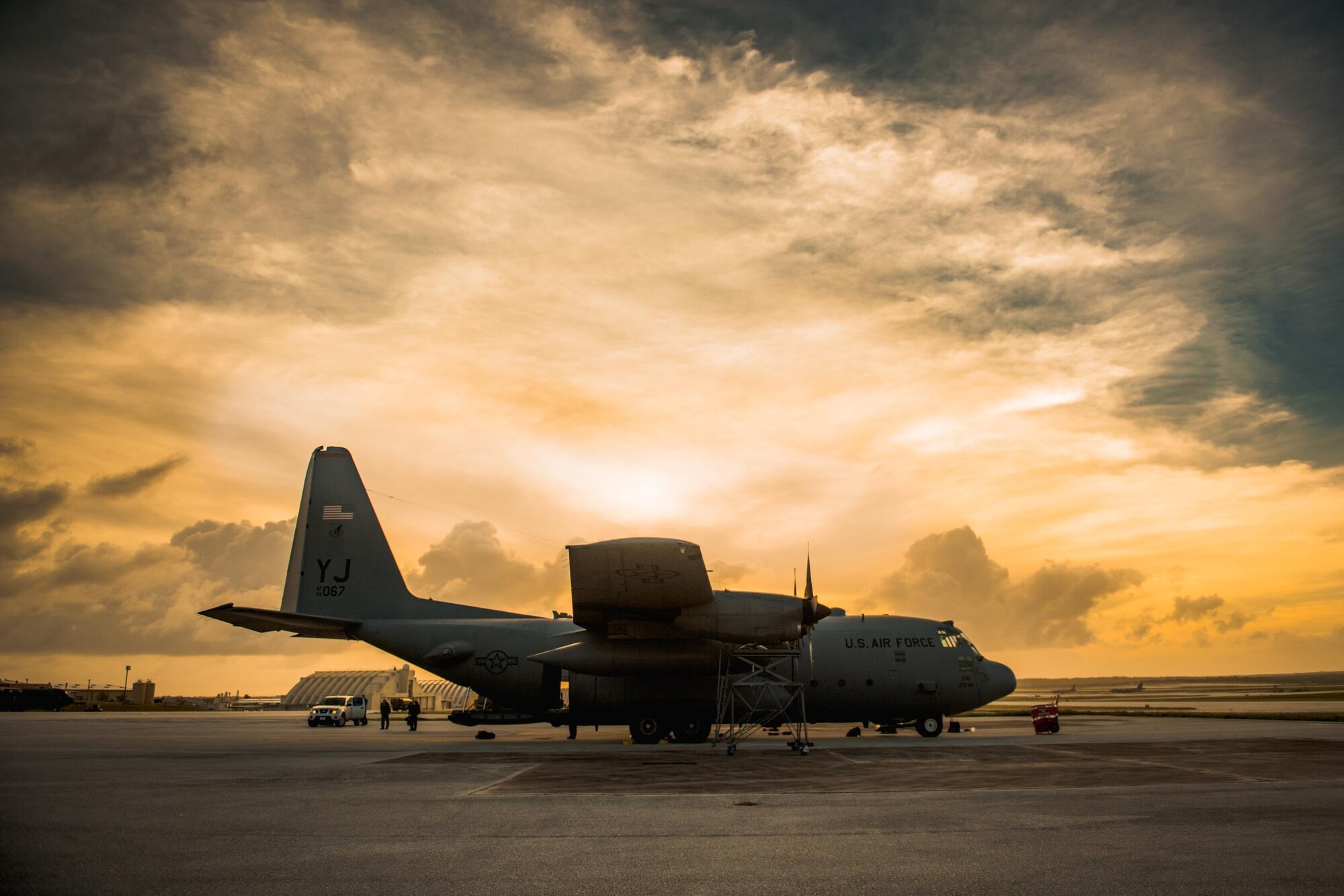 A C-130 Hercules sit on the runway during Operation Christmas Drop 2016 at Andersen Air Force Base, Guam, Dec. 6, 2016. This year marks the 65th year of Operation Christmas Drop, which began in 1952, making it the world's longest-running airdrop mission. (U.S. Air Force photo by Senior Airman Delano Scott/Released)