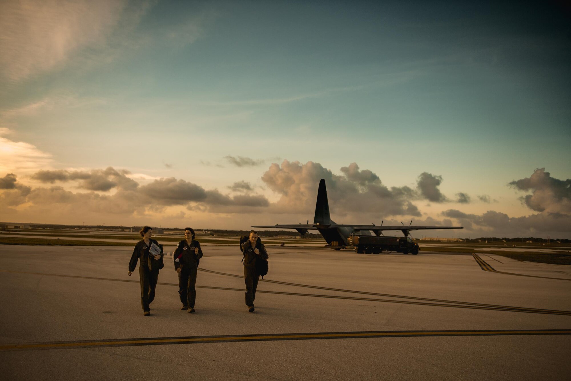 C-130 Hercules crewmembers exit the aircraft after delivering low cost, low altitude humanitarian airdrops during Operation Christmas Drop 2016 at Andersen Air Force Base, Guam, Dec. 6, 2016. Operation Christmas Drop highlights the U.S. and allied airpower capabilities to orient and respond to activities in peacetime and crisis. In addition to delivering critical supplies to those in need, Operation Christmas Drop provides specific training to U.S. and allied aircrews, enabling theater-wide airpower. (U.S. Air Force photo by Senior Airman Delano Scott/Released)