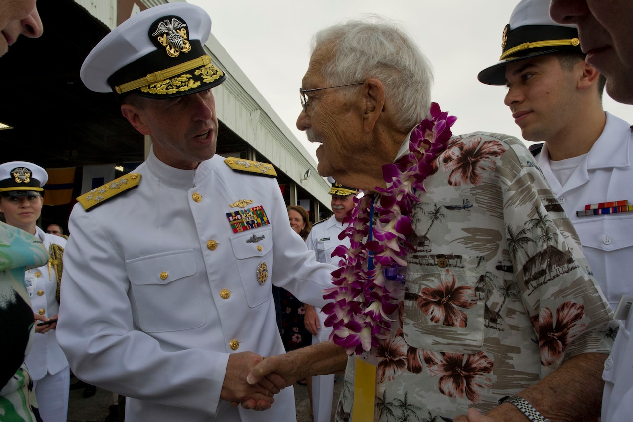 Chief of Naval Operations Navy Adm. John M. Richardson greets veteran Ralph Goodwin at the 75th anniversary commemoration of the Pearl Harbor attack at Joint Base Pearl Harbor-Hickam, Hawaii, Dec. 7, 2016. DoD photo by Lisa Ferdinando