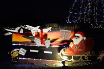 The 47th Student Squadron holiday card sits by the Christmas tree on Laughlin Air Force Base Nov. 30. The card received the Holiday and Squadron Spirit award for the 2016 Holiday Card Contest. (U.S. Air Force photo/Airman 1st Class Benjamin N. Valmoja)