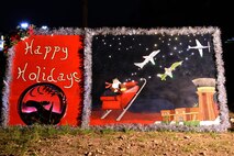 The 47th Operations Support Squadron holiday card sits by the Christmas tree on Laughlin Air Force Base Nov. 30. The card received the Originality and Creativity award for the 2016 Holiday Card Contest. (U.S. Air Force Photo/Airman 1st Class Benjamin N. Valmoja)