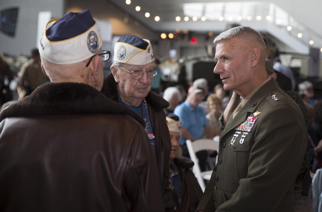 Lt. Gen. Rex C. McMillian (right), commander of Marine Forces Reserve and Marine Forces North, speaks with retired Lt. Cmdr. Cass E. Phillips (left) and Chief Warrant Offcer 4 Francis L. Emond (middle), Navy veterans who served during World War II, during a commemorative ceremony at the National World War II Museum, Dec. 7, 2016, for the 75th anniversary of the attack on Pearl Harbor. The event honored the service members who were present during the fateful attack on Dec. 7, 1941. During World War II, by September of 1945, Reserve Marines made up 70 percent of total wartime Marine Corps personnel. For information on the history and heritage of the Marine Corps Reserve as well as current Marine stories and upcoming Centennial events, please visit www.marines.mil/usmcr100. (U.S. Marine Corps photo by Sgt. Ian Leones)