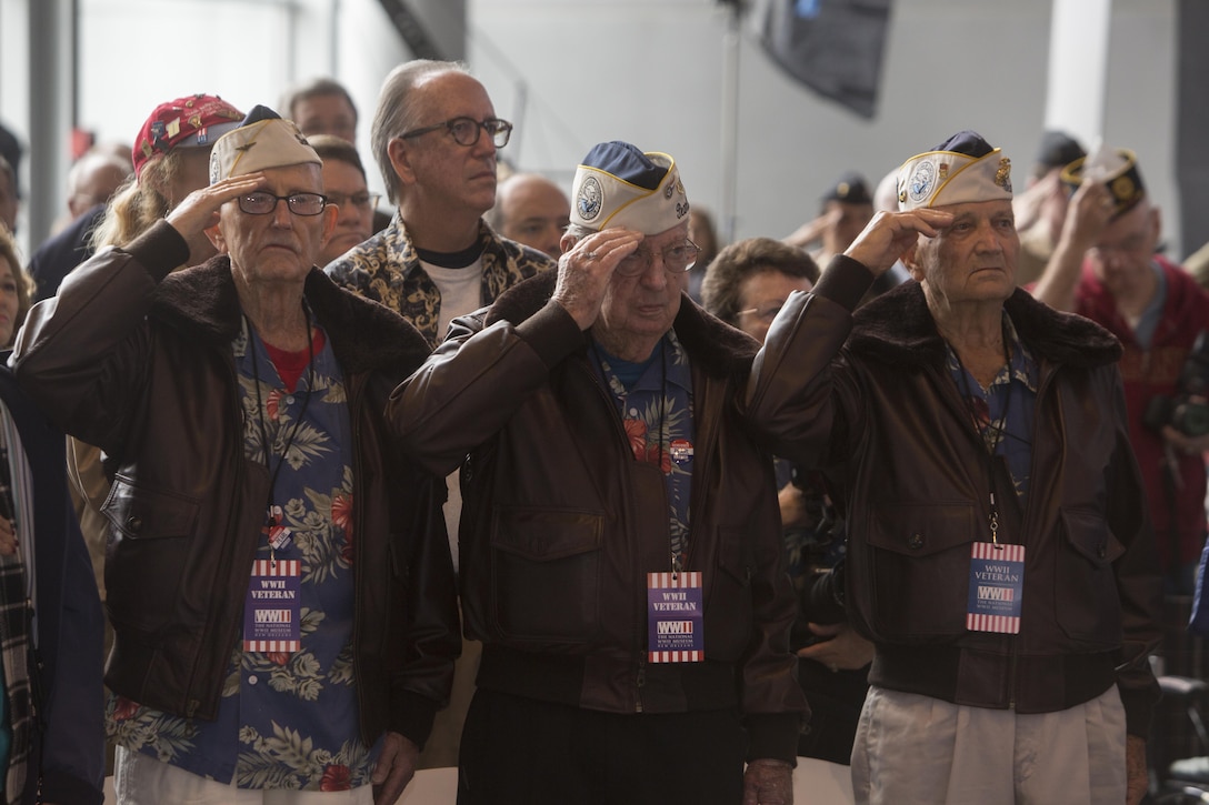 Retired Lt. Cmdr. Cass E. Phillips, retired Navy Chief Warrant Officer 4 Francis L. Emond and retired Marine Corps Sgt. Maj. William M. Braddock, survivors of the attack on Pearl Harbor, salute the colors during a commemorative ceremony at the National World War II Museum, Dec. 7, 2016, for the 75th anniversary of Pearl Harbor. The event honored the service members who were present during the fateful attack on Dec. 7, 1941. During World War II, by September of 1945, Reserve Marines made up 70 percent of total wartime Marine Corps personnel. For information on the history and heritage of the Marine Corps Reserve as well as current Marine stories and upcoming Centennial events, please visit www.marines.mil/usmcr100. (U.S. Marine Corps photo by Sgt. Ian Leones)