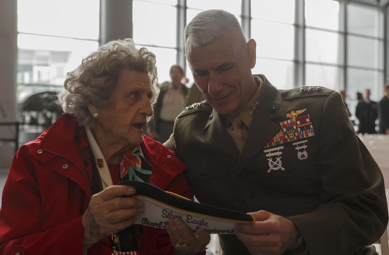 Lt. Gen. Rex C. McMillian, commander of Marine Forces Reserve and Marine Forces North, talks to Angie Engel, whose husband served as a Navy pilot at Pearl Harbor, during a commemorative ceremony at the National World War II Museum, Dec. 7, 2016, for the 75th anniversary of the attack on Pearl Harbor. The event honored the service members who were present during the fateful attack on Dec. 7, 1941. During World War II, by September of 1945, Reserve Marines made up 70 percent of total wartime Marine Corps personnel. For information on the history and heritage of the Marine Corps Reserve as well as current Marine stories and upcoming Centennial events, please visit www.marines.mil/usmcr100. (U.S. Marine Corps photo by Sgt. Ian Leones)