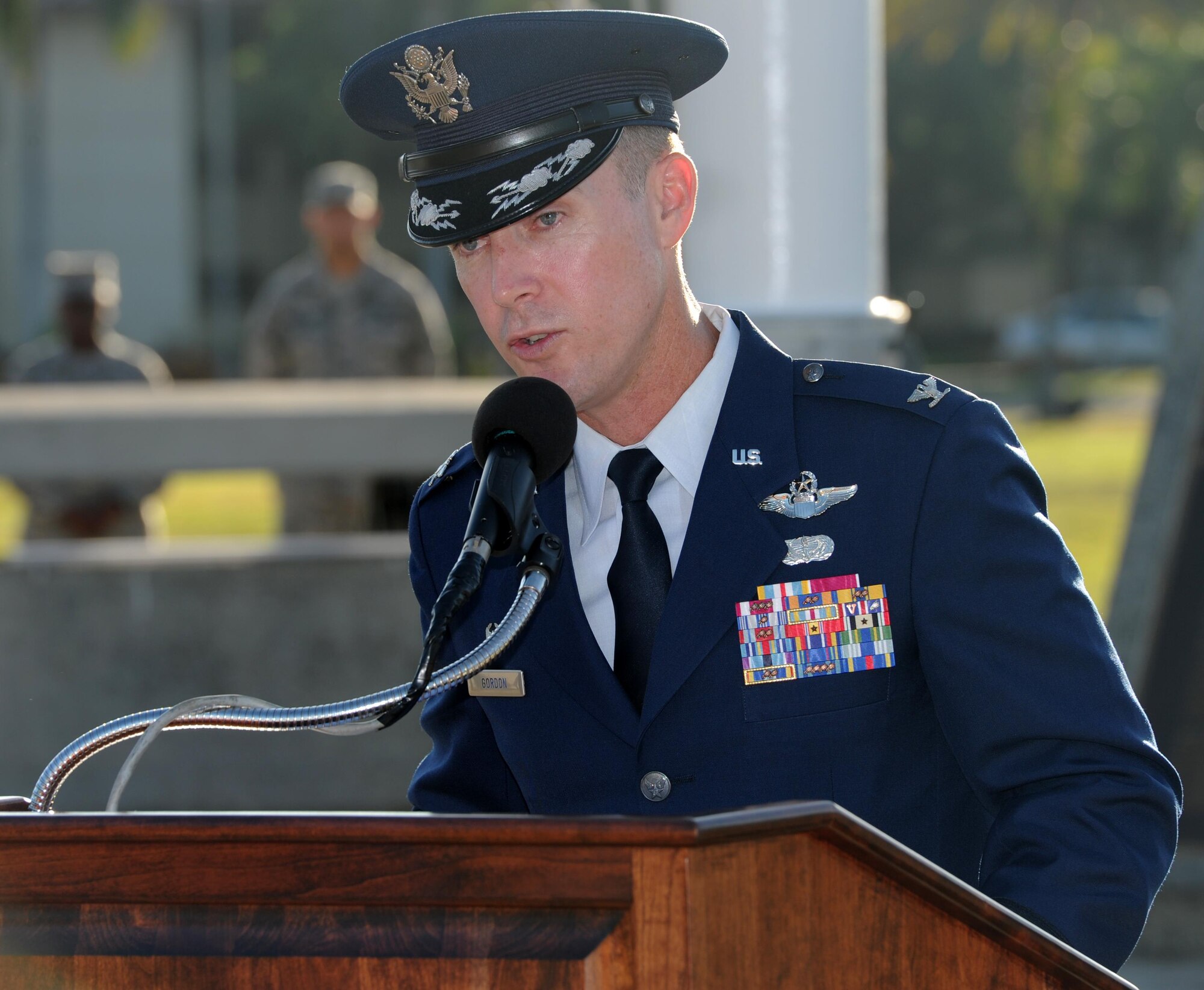 Col. Kevin Gordon, 15th Wing commander, delivers a speech during the 75th Commemoration of the December 7, 1941 attack on Hickam Field ceremony  Dec. 7, 2016, at Joint Base Pearl Harbor-Hickam, Hawaii. The attacks on seven bases throughout Oahu precipitated America's entry into World War II, and the annual commemoration ceremony is designed to foster reflection, remembrance, and understanding for those affected by the events that took place 75 years ago. (U.S. Air Force photo by Tech. Sgt. Nathan Allen)