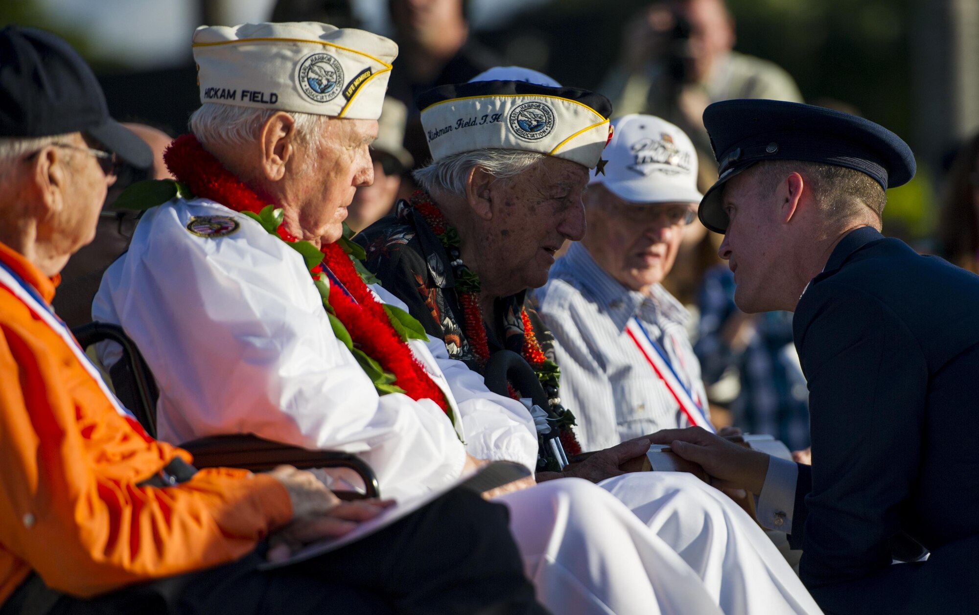 Col. Kevin Gordon, 15th Wing commander, presents a gift to (retired) Command Sgt. Maj. Armando Galella during the 75th Commemoration of the Dec. 7, 1941 attack on Hickam Field ceremony Dec. 7, 2016, at Joint Base Pearl Harbor-Hickam, Hawaii. On Dec. 7, 1941, Galella was assigned to the  428th Signal Maintenance company. After the attack, he served in Guadalcanal, Leyte Gulf, Iwo Jima, and Okinawa, earning the Bronze Star and a number of other awards. Galella's best friend, Jack Horan, was killed during the attack and Galella's presence at the ceremony was dedicated to Jack's memory. (U.S. Air Force photo by Tech. Sgt. Nathan Allen)