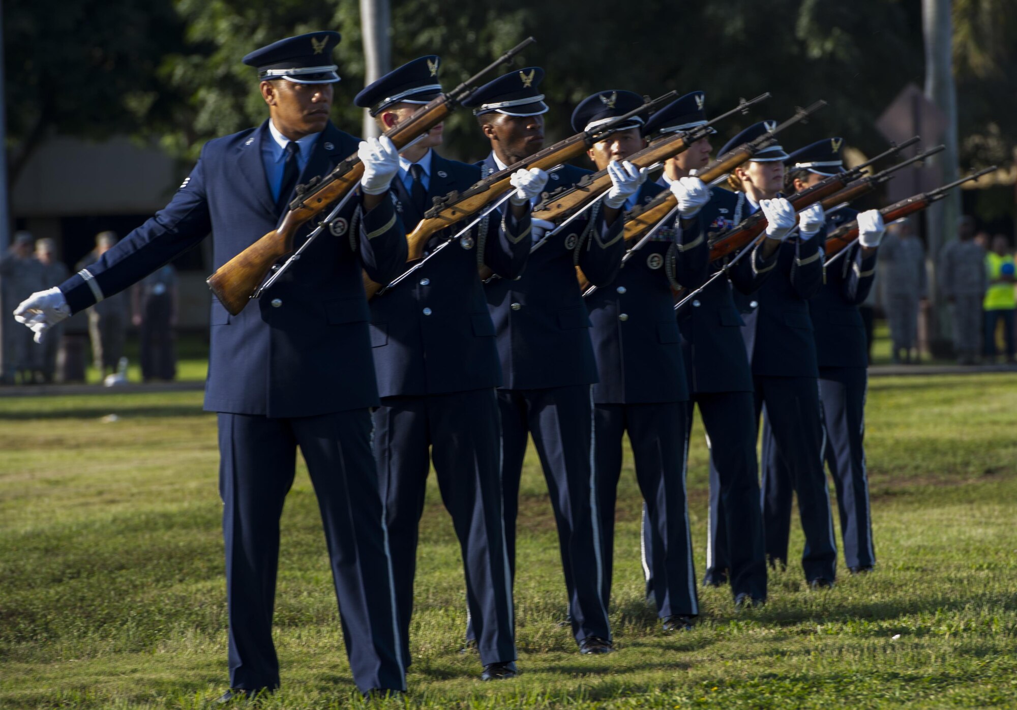 Members of the Hickam Honor Guard perform a 21-Gun Salute during the 75th Commemoration of the Dec. 7, 1941 attack on Hickam Field ceremony Dec. 7, 2016, at Joint Base Pearl Harbor-Hickam, Hawaii. The attacks on seven bases throughout Oahu precipitated America's entry into World War II, and the annual commemoration ceremony is designed to foster reflection, remembrance, and understanding for those affected by the events that took place 75 years ago. (U.S. Air Force photo by Tech. Sgt. Nathan Allen)