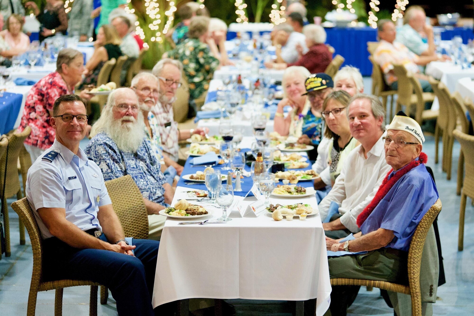 U.S. Air Force Maj. Gen. Mark Dillon, Pacific Air Forces vice commander, and Clifford McFarland, Dec. 7 attacks survivor, enjoy their meals during a rememberance dinner, Dec. 6, 2016, Joint Base Pearl Harbor-Hickam, Hawaii. The dinner was part of a week long celebration commemorating the 75th anniversary of the attacks on Pearl Harbor, Hickam Field and Oahu. The U.S. military and the State of Hawaii are hosting a series of remembrance events to honor the Pacific Theater's veterans. (U.S. Air Force photo by Tech. Sgt. James Stewart/Released)