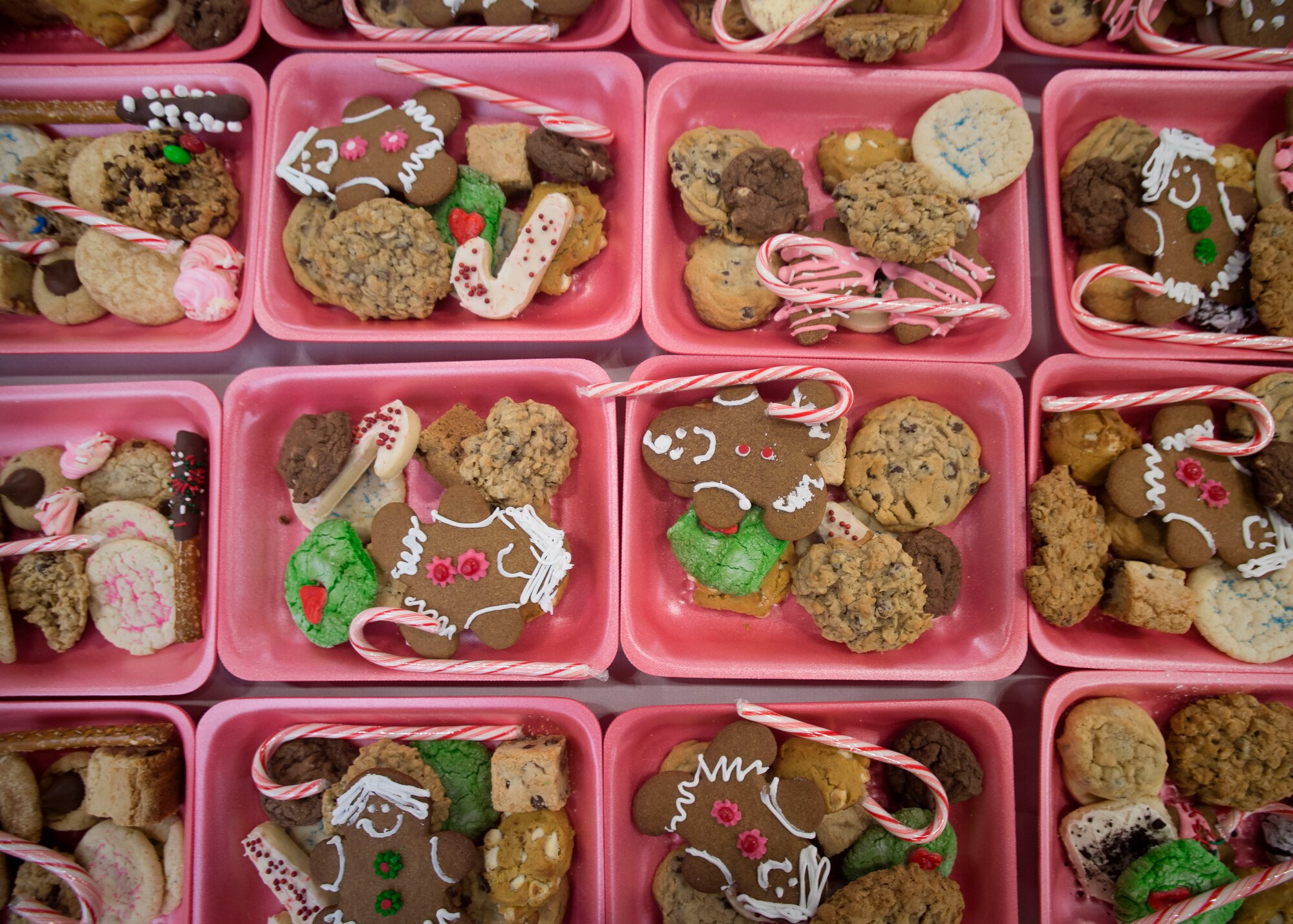 Cookies line tables at the officer’s club ballroom during the annual Cookie Caper event at Misawa Air Base, Japan, Dec. 7, 2016.  The 2016 Cookie Caper baked more than 21,000 cookies for unaccompanied service members throughout the base during the holiday season. (U.S. Air Force photo by Senior Airman Deana Heitzman)