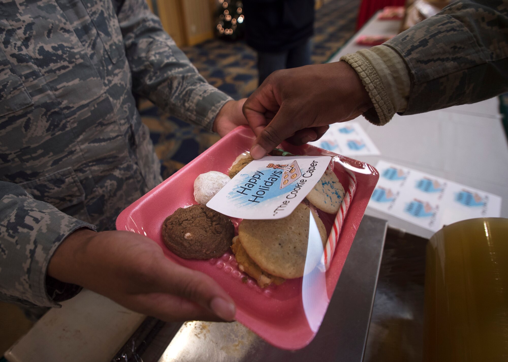 U.S. Air Force Airmen package cookies for delivery during the annual Cookie Caper event at Misawa Air Base, Japan, Dec. 7, 2016. After the cookies are divided and packaged, first sergeants and other leadership across the base hand delivered them to their units.  (U.S. Air Force photo by Senior Airman Deana Heitzman)