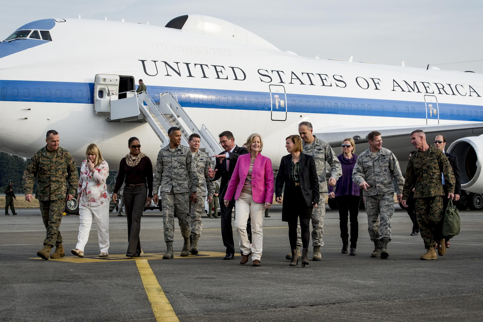 U.S. Secretary of Defense Ashton B. Carter walks from plane with official greeting party Dec. 5, 2016 upon arrival to Yokota Air Base, Japan. Carter stopped at Yokota during his travel to U.S. military instillations across the world, with plans to thank deployed U.S. troops for their service over the holidays. (U.S. Air Force photo by Airman 1st Class Donald Hudson/Released)