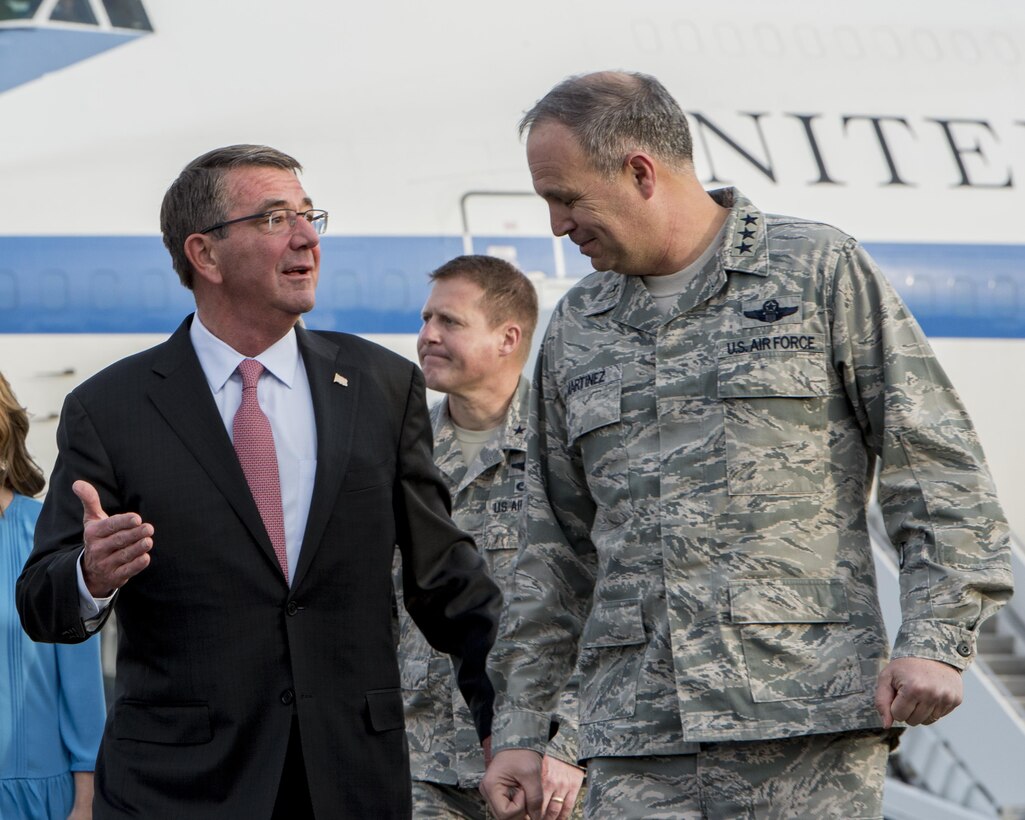 U.S. Secretary of Defense Ashton B. Carter speaks with U.S. Air Force Lt. Gen. Jerry P. Martinez on Dec. 5, 2016 at Yokota Air Base, Japan. Carter stopped at Yokota during his travel to U.S. military instillations across the world, with plans to advance U.S. priorities including the rebalance to the Asia-Pacific region. (U.S. Air Force photo by Airman 1st Class Donald Hudson/Released)
