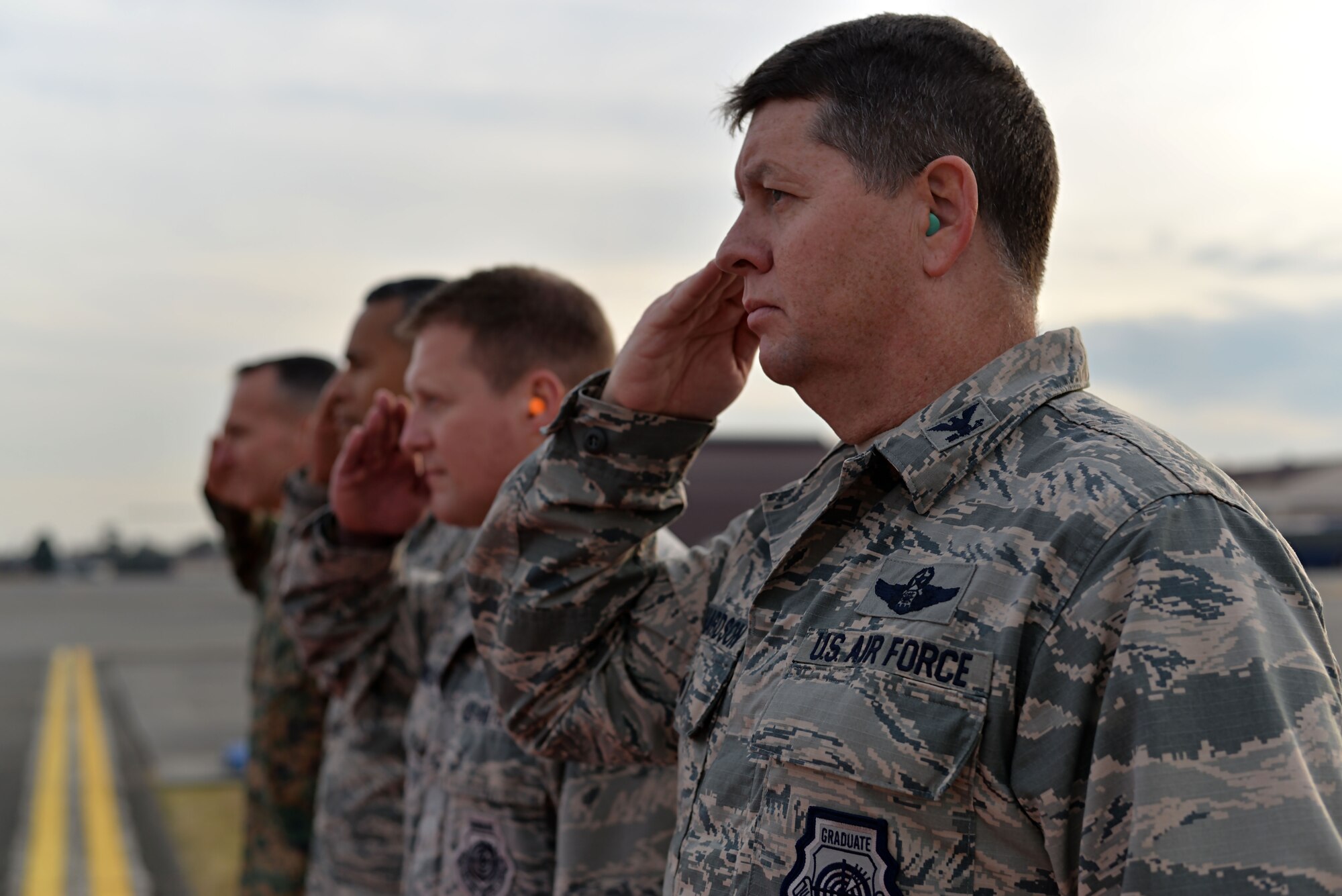 U.S. Air Force Col. Neil R. Richardson, 374th Airlift Wing vice commander, salutes during the departure of the Secretary of Defense Ashton B. Carter on Dec. 5, 2016, at Yokota Air Base, Japan. Carter stopped at Yokota during his travel to U.S. military instillations across the world, with plans to thank deployed U.S. troops for their service over the holidays. (U.S. Air Force photo by Airman 1st Class Juan Torres/Released)