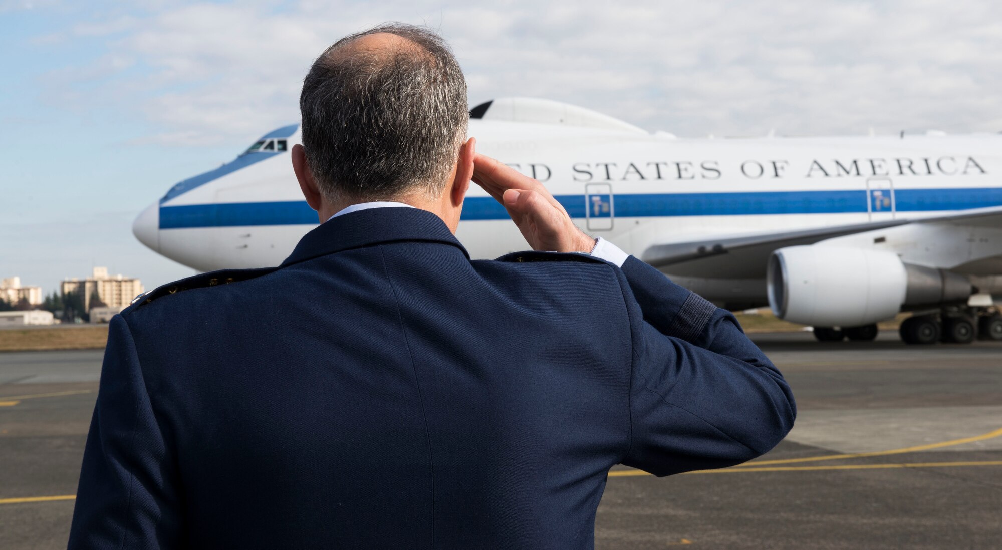 U.S. Air Force Lt. Gen. Jerry P. Martinez, U.S. Forces Japan and 5th Air Force commander, salutes for the official departure of U.S. Secretary of Defense Ashton B. Carter Dec. 7, 2016, at Yokota Air Base, Japan. Carter stopped at Yokota during his travel to U.S. military instillations across the world, with plans to thank deployed U.S. troops for their service over the holidays. (U.S. Air Force photo by Airman 1st Class Juan Torres/Released)