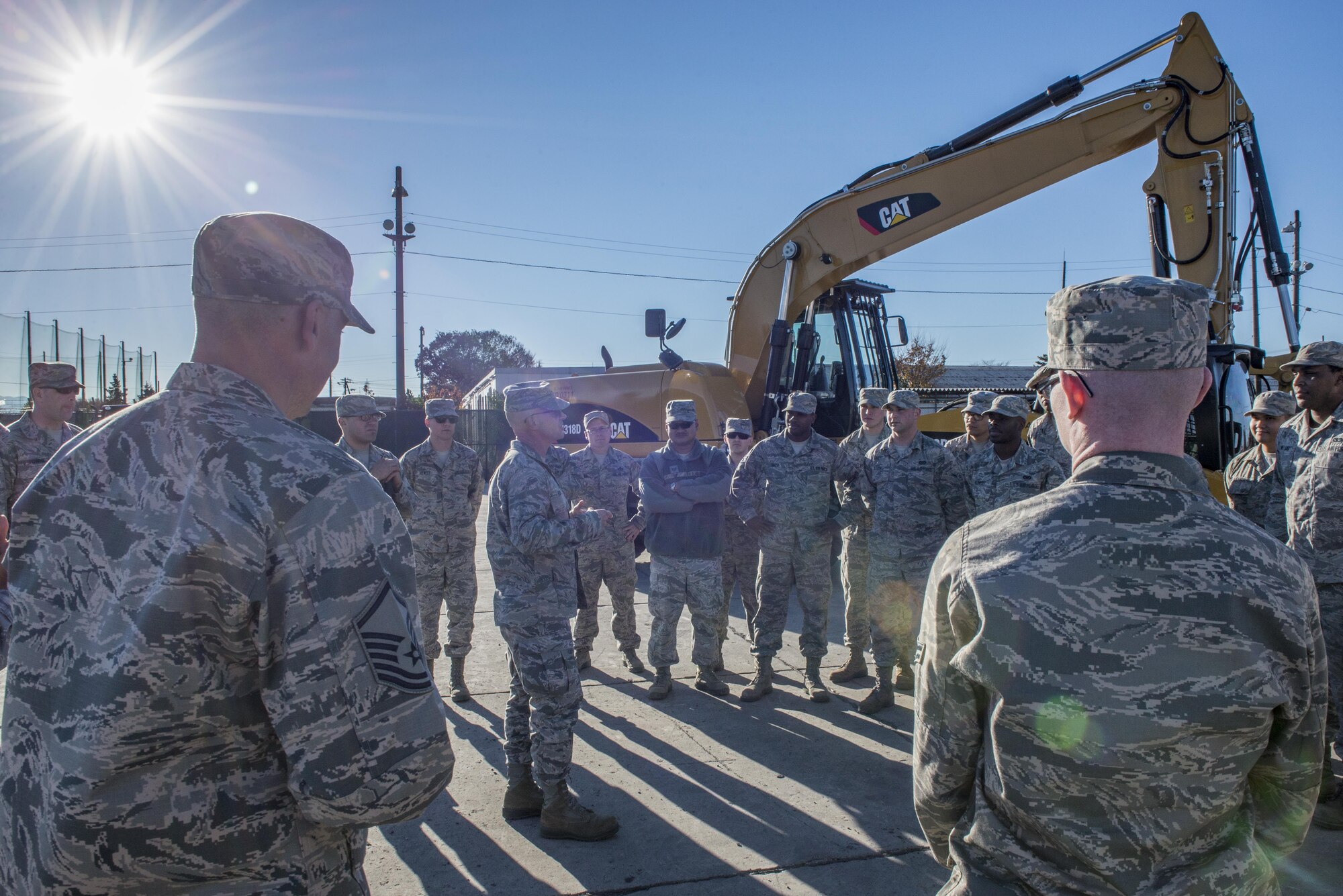 U.S. Air Force Col. Dwayne M. Robison, Pacific Air Force A4C, speaks to Airman from the 374th Civil Engineering Squadron upon completion of a Rapid Airfield Damage Repair demonstration for Japan Air Self Defense Force members Dec. 6, 2016, at Yokota Air Base, Japan. In addition to the RADR demonstration, during a three-day course, the 374th CES showed JASDF members techniques and capabilities in; explosive ordinance disposal, air field damage plotting and chemical, biological, radiological and nuclear defense. (U.S. Air Force photo by Airman 1st Class Donald Hudson/Released)
