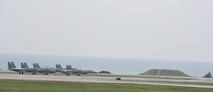 U.S. Air Force F-15 Eagles from the 67th Fighter Squadron wait to take off Dec. 6, 2016, at Kadena Air Base, Japan. The F-15 Eagle's air superiority is achieved through a mixture of exceptional maneuverability and acceleration, range, weapons and avionics. (U.S. Air Force photo by Senior Airman Lynette M. Rolen/Released)
