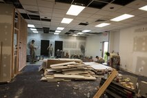 U.S. Air Force Airmen from the 18th Civil Engineer Squadron renovate the interior of a building Dec. 7, 2016, at Kadena Air Base, Japan. The 18th CES structures shop ensures buildings are mission-capable at all times. (U.S. Air Force photo by Senior Airman Lynette M. Rolen/Released)
