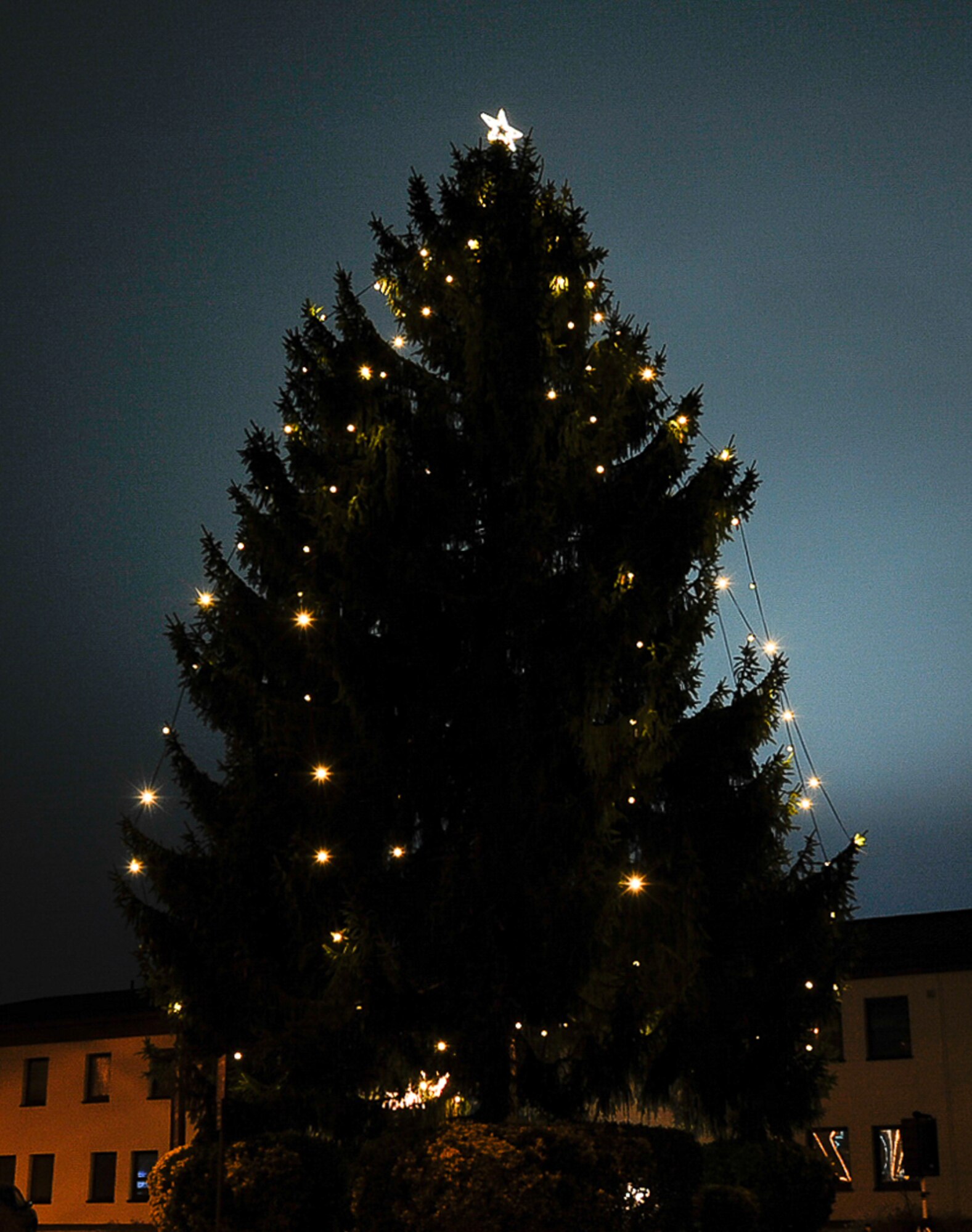 The 86th Medical Group Christmas tree is displayed at Ramstein Air Base, Germany, Dec. 1, 2016. The 86th MDG Airmen and their families gathered around the Christmas tree to celebrate the start of the  holiday season. Families sipped warm beverages provided by the Enlisted Spouses Club and watched the 86th Medical Support Squadron dominate the caroling competition. (U.S. Air Force photo/Airman 1st Class Savannah L. Waters)