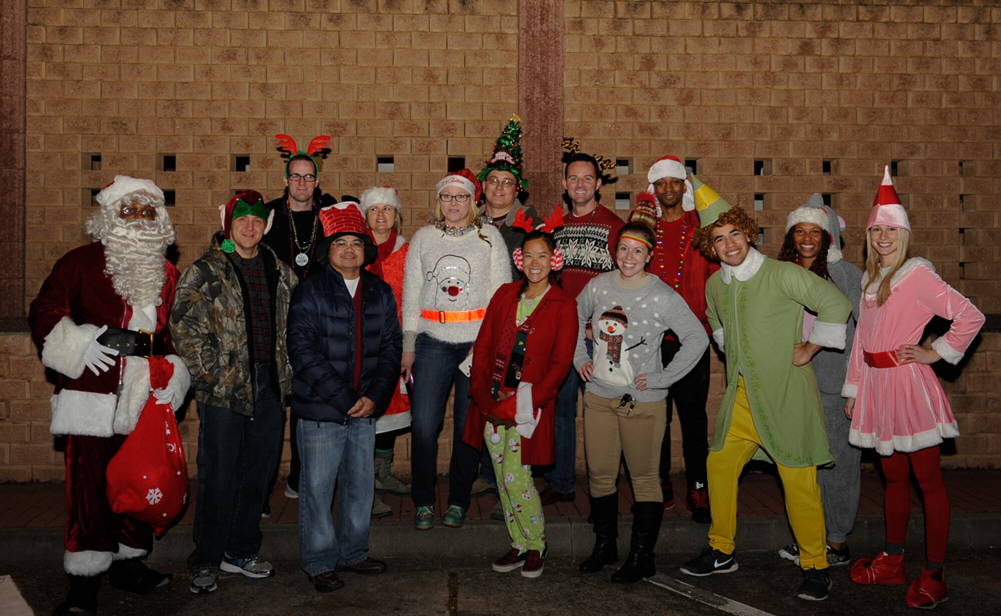 Carolers from the 86th Medical Support Squadron pose for a group photo at the 86th Medical Group Christmas tree lighting ceremony at Ramstein Air Base, Germany, Dec. 1, 2016. The 86th MDSS won a caroling competition between all of the medical squadrons during the event. (U.S. Air Force photo/Airman 1st Class Savannah L. Waters)