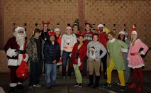 Carolers from the 86th Medical Support Squadron pose for a group photo at the 86th Medical Group Christmas tree lighting ceremony at Ramstein Air Base, Germany, Dec. 1, 2016. The 86th MDSS won a caroling competition between all of the medical squadrons during the event. (U.S. Air Force photo/Airman 1st Class Savannah L. Waters)