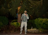 Staff Sgt. Quentin Richardson, 86th Medical Support Squadron facility management NCO in charge, announces the beginning of the caroling competition at the 86th MDG Christmas tree lighting ceremony at Ramstein Air Base, Germany, Dec. 1, 2016. This was the second annual 86th MDG Christmas tree lighting to celebrate the beginning of the Christmas season. (U.S. Air Force photo/Airman 1st Class Savannah L. Waters)