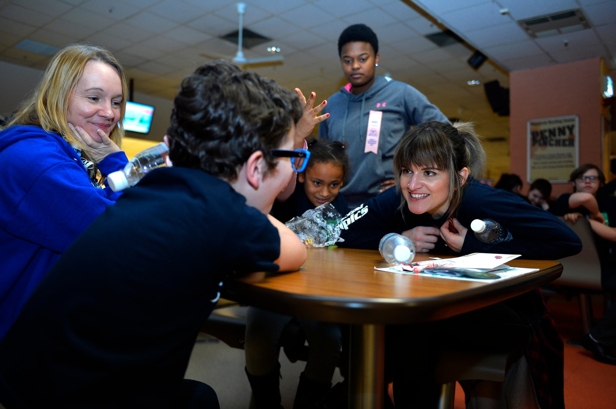 Volunteers and students interact during the 2016 Winter Special Olympics at Vogelweh Military Complex, Germany, Dec. 2, 2016. Volunteers from around the Kaiserslautern Military Community gathered at Vogelweh to help special needs children, both Americans and Germans, play games and participate in other activities. (U.S. Air Force photo by Airman 1st Class Joshua Magbanua)