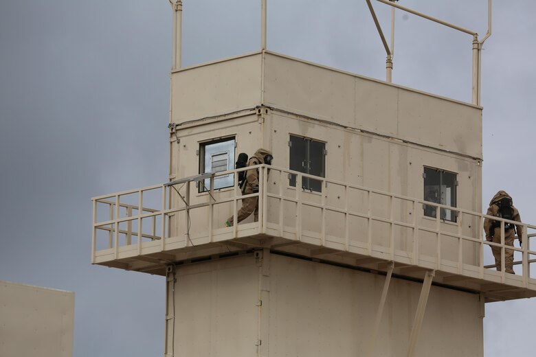 Marines circle the top of a tower during a field exercise at Marine Corps Outlying Field Atlantic Nov. 30, 2016. Twenty-two Marines with Chemical, Biological, Radiological and Nuclear Defense, 2nd Marine Aircraft Wing, conducted a week-long annual training exercise that refreshed the defense specialists on the roots of their basic military occupational specialty training. The exercise included an assortment of stations and classes that tested the Marines physically and mentally. (U.S. Marine Corps photo by Lance Cpl. Cody Lemons/Released)