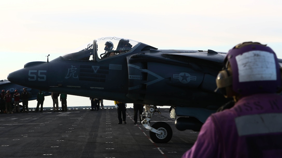 An AV-8B Harrier II with Marine Medium Tiltrotor Squadron 264 (Reinforced), 22nd Marine Expeditionary Unit, prepares to park on the flight deck of the amphibious assault ship USS Wasp (LHD-1) on Dec. 5, 2016. The 22nd MEU, deployed with the Wasp Amphibious Ready Group, is conducting naval operations in support of U.S. national security interests in Europe.