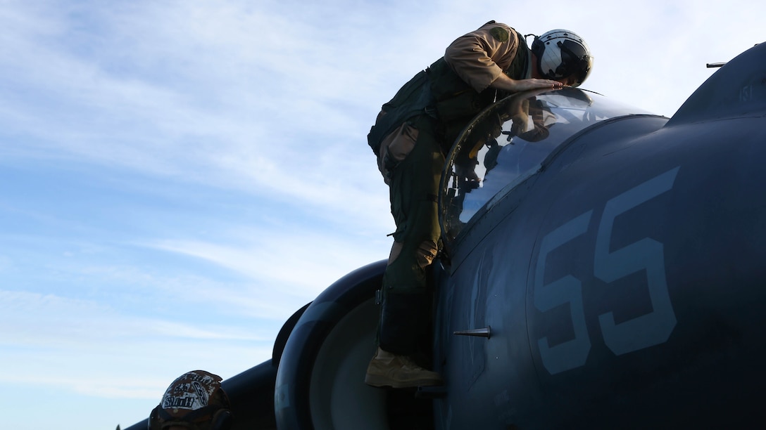 A pilot with Marine Medium Tiltrotor Squadron 264 (Reinforced), 22nd Marine Expeditionary Unit, gets out of an AV-8B Harrier II on the flight deck of the amphibious assault ship USS Wasp (LHD-1) on Dec. 5, 2016. The 22nd MEU, deployed with the Wasp Amphibious Ready Group, is conducting naval operations in support of U.S. national security interests in Europe.