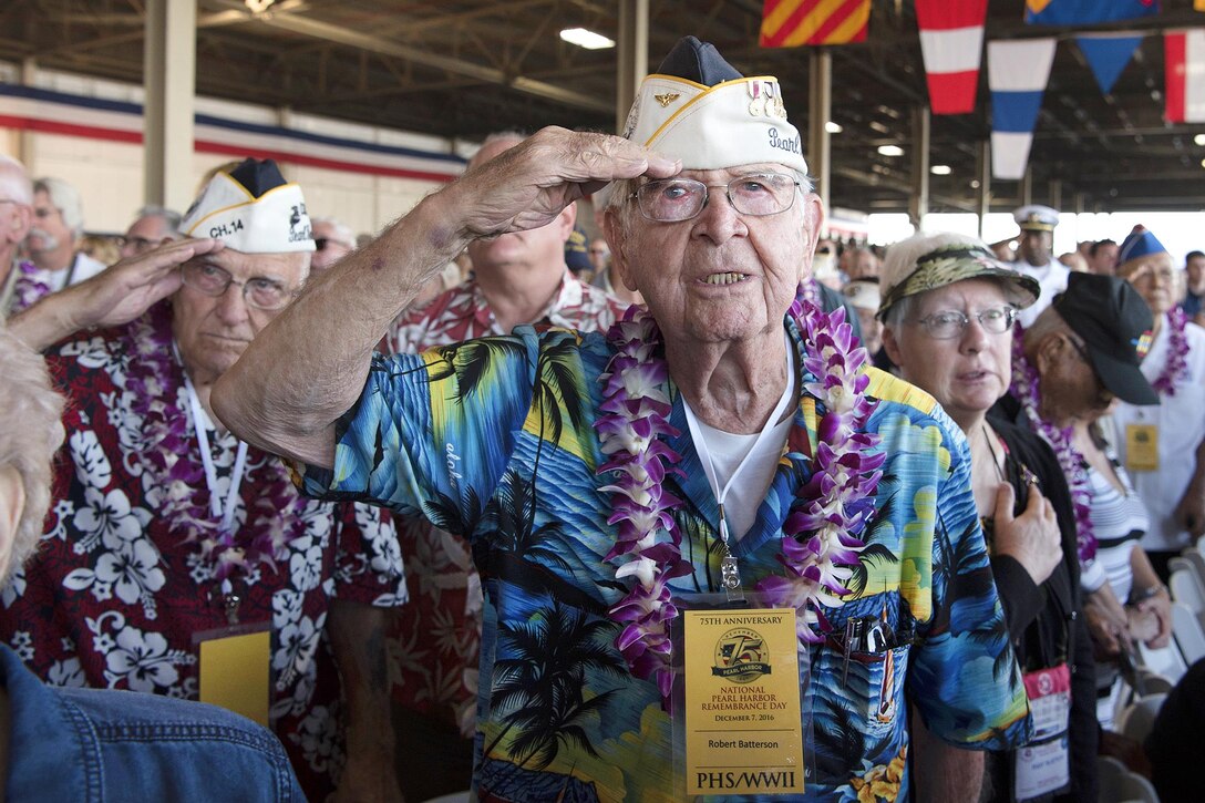 Pearl Harbor survivor Robert Batterson, foreground, salutes during the national anthem at the 75th Pearl Harbor Commemoration Ceremony, Pearl Harbor, Hawaii, Dec. 7, 2016. Navy photo by Petty Officer 2nd Class Shaun Griffin