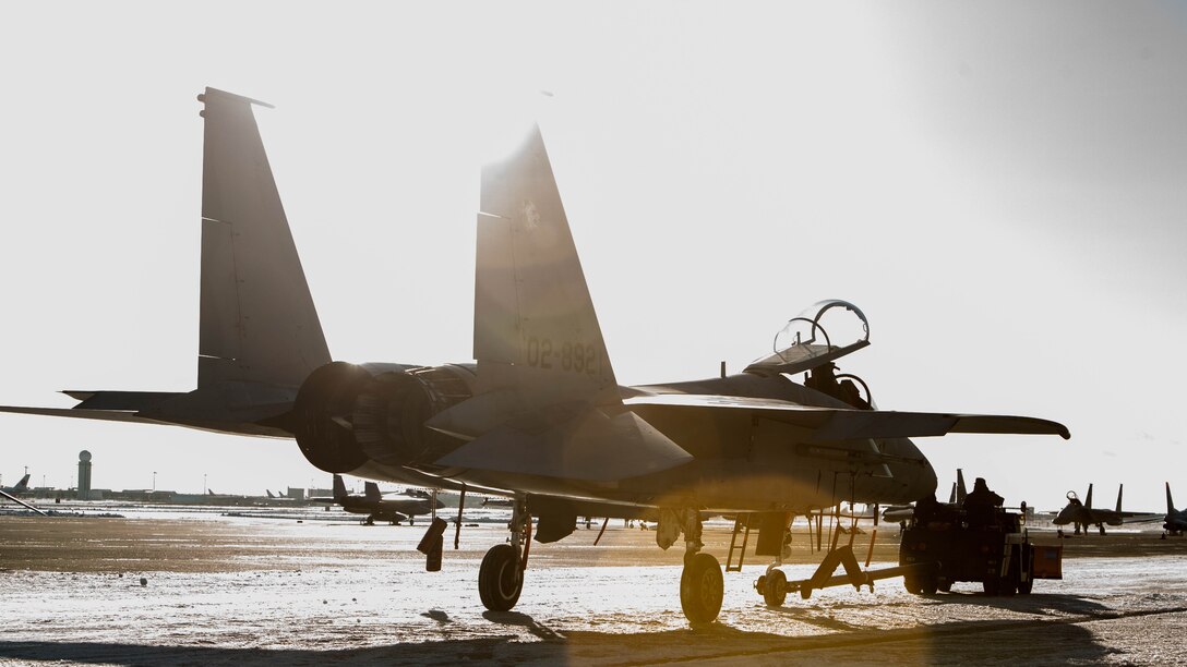 A Japan Air Self-Defense Force F-15 is pulled onto the flight line during the Aviation Relocation Training Program at Chitose Air Base, Japan, Dec. 7, 2016. JASDF and U.S. Marine Corps aircraft fly daily as part of the ATR. The ATR is an effort to increase operational readiness between the U.S. Marine Corps and the Japan Air Self-Defense Force, improve interoperability and reduce noise concerns of aviation training on local communities by disseminating training locations throughout Japan. 