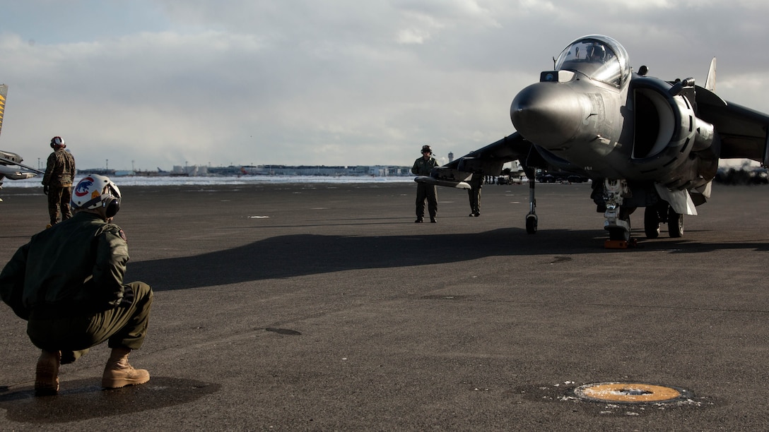 A U.S. Marine Corps AV-8B Harrier with Marine Attack Squadron (VMA) 542 waits on the flight line before a routine inspection during the Aviation Training Relocation Program at Chitose Air Base, Japan, Dec. 7, 2016. VMA-542 is conducting training with their harriers at Chitose Air Base in an effort to increase operational readiness between the U.S. Marine Corps and the Japan Air Self-Defense Force, improve interoperability and reduce noise concerns of aviation training on local communities by disseminating training locations throughout Japan. 