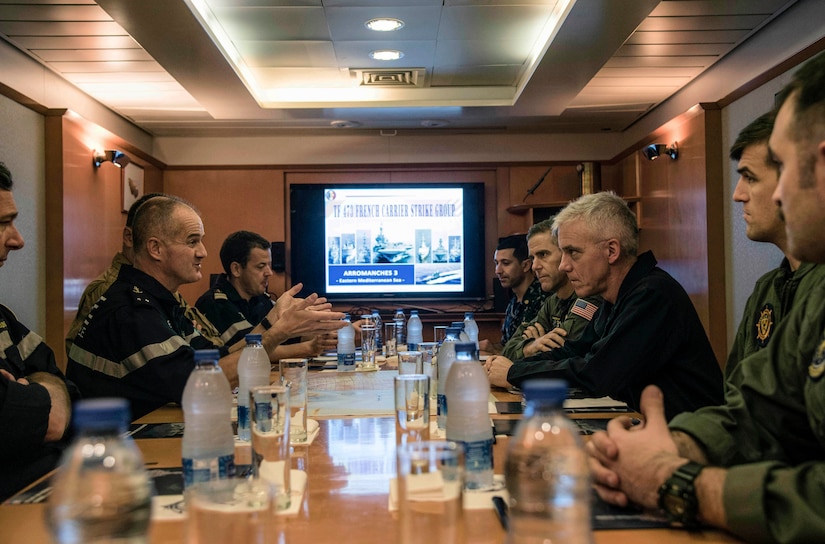 161206-N-XD363-021
MEDITERRANEAN SEA (Dec. 6, 2016) Rear Adm. James Malloy, commander, Carrier Strike Group (CSG) 10, meets with French Rear Adm. Olivier Lebas, left, commander, Task Force 473, on the aircraft carrier FS Charles de Gaulle (R91). CSG 10 is deployed as part of the Eisenhower Carrier Strike Group to conduct naval operations in the U.S. 6th Fleet area of operations in support of U.S. national security interests in Europe. (U.S. Navy photo by Petty Officer 2nd Class Michael R. Gendron/Released)