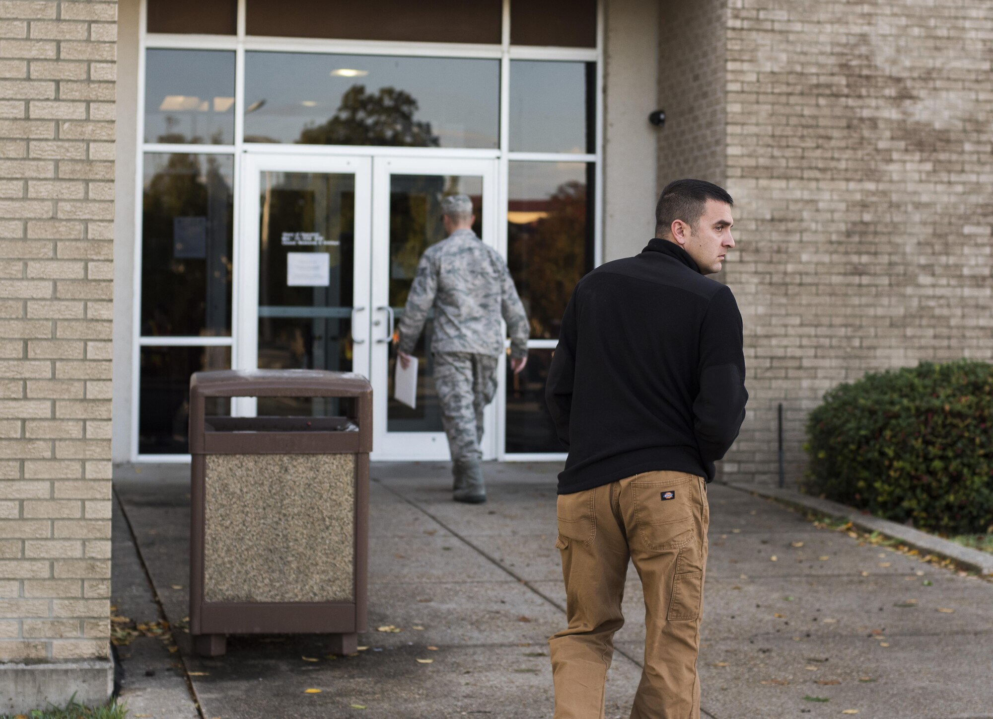 Master Sgt. Jeremy Utphall, 2nd Bomb Wing Inspector General exercise division superintendent, looks over his shoulder as he heads into the medical building during an active shooter exercise at Barksdale Air Force Base, La., Nov. 29, 2016. Like an actual active shooter incident, Airmen weren’t given a warning. While some were caught off guard, others implemented their training and avoided Utphall as he searched the medical building for potential victims. (U.S. Air Force photo/Senior Airman Damon Kasberg)