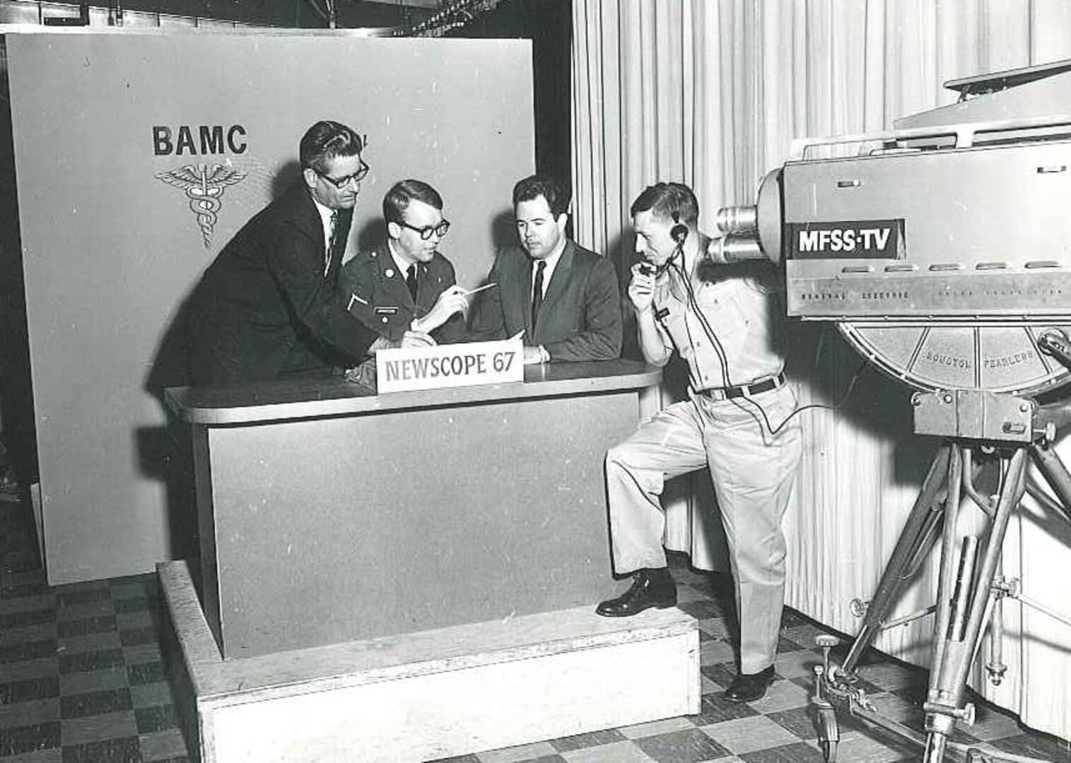 Brooke Army Medical Center/Medical Field Service School television, or BAMC/MFSS-TV, personnel prepare for a broadcast in March 1967.  BAMC/MFSS-TV news clips were aired on post, as well as by commercial and educational news stations in the San Antonio area.
