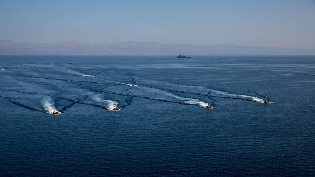 U.S. 5TH FLEET AREA OF OPERATIONS (Dec. 6, 2016) Amphibious assault vehicles with the 11th Marine Expeditionary Unit (MEU) debark from the USS Comstock (LSD 45) to conduct an amphibious assault rehearsal as part of Exercise Alligator Dagger, Dec. 6, 2016. The Makin Island Amphibious Ready Group (ARG) and 11th Marine Expeditionary Unit (MEU) will conduct amphibious operations and combat sustainment training throughout Dec. The ARG/MEU Navy-Marine Corps team is operating in the U.S. 5th Fleet area of responsibility in support of maritime security operations, crisis response, and theater security cooperation efforts to ensure the free flow of commerce, freedom of navigation and regional security. (U.S. Marine Corps photo by Cpl. Devan K. Gowans)