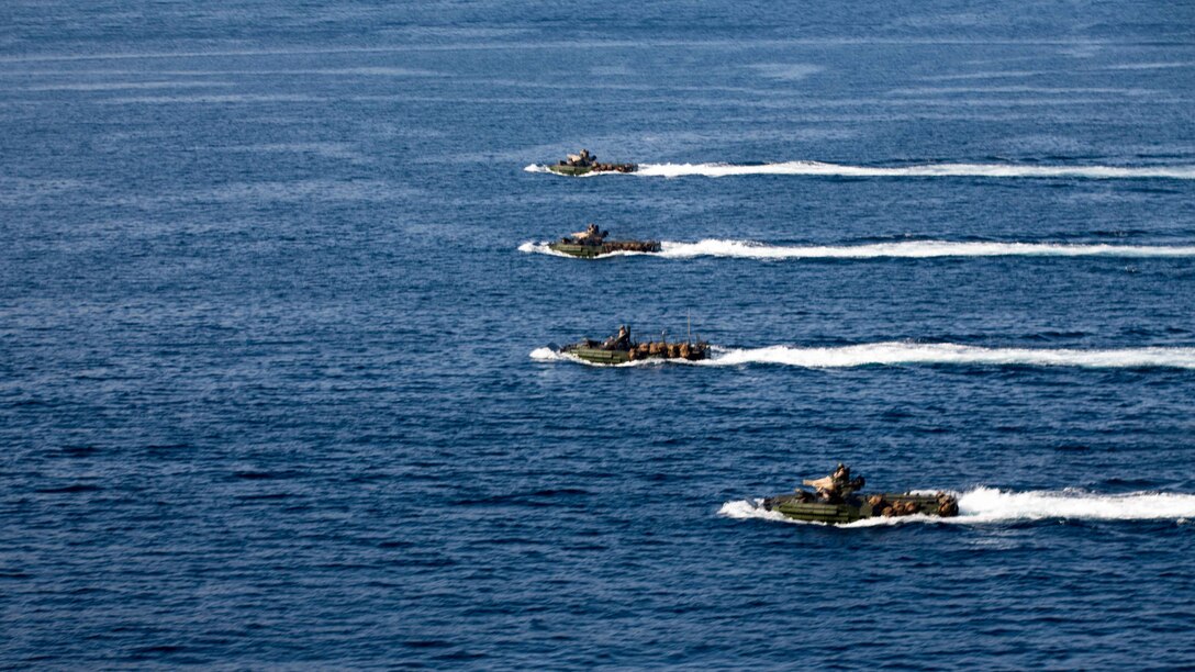 U.S. 5TH FLEET AREA OF OPERATIONS (Dec. 6, 2016) Amphibious assault vehicles with the 11th Marine Expeditionary Unit move in formation through the Gulf of Aden during an amphibious assault rehearsal as part of Exercise Alligator Dagger, Dec. 6, 2016. The Makin Island Amphibious Ready Group (ARG) and 11th Marine Expeditionary Unit (MEU) will conduct amphibious operations and combat sustainment training. The ARG/MEU Navy-Marine Corps team is operating in the U.S. 5th Fleet area of responsibility in support of maritime security operations, crisis response, and theater security cooperation efforts to ensure the free flow of commerce, freedom of navigation and regional security. (U.S. Marine Corps photo by Cpl. Devan K. Gowans)