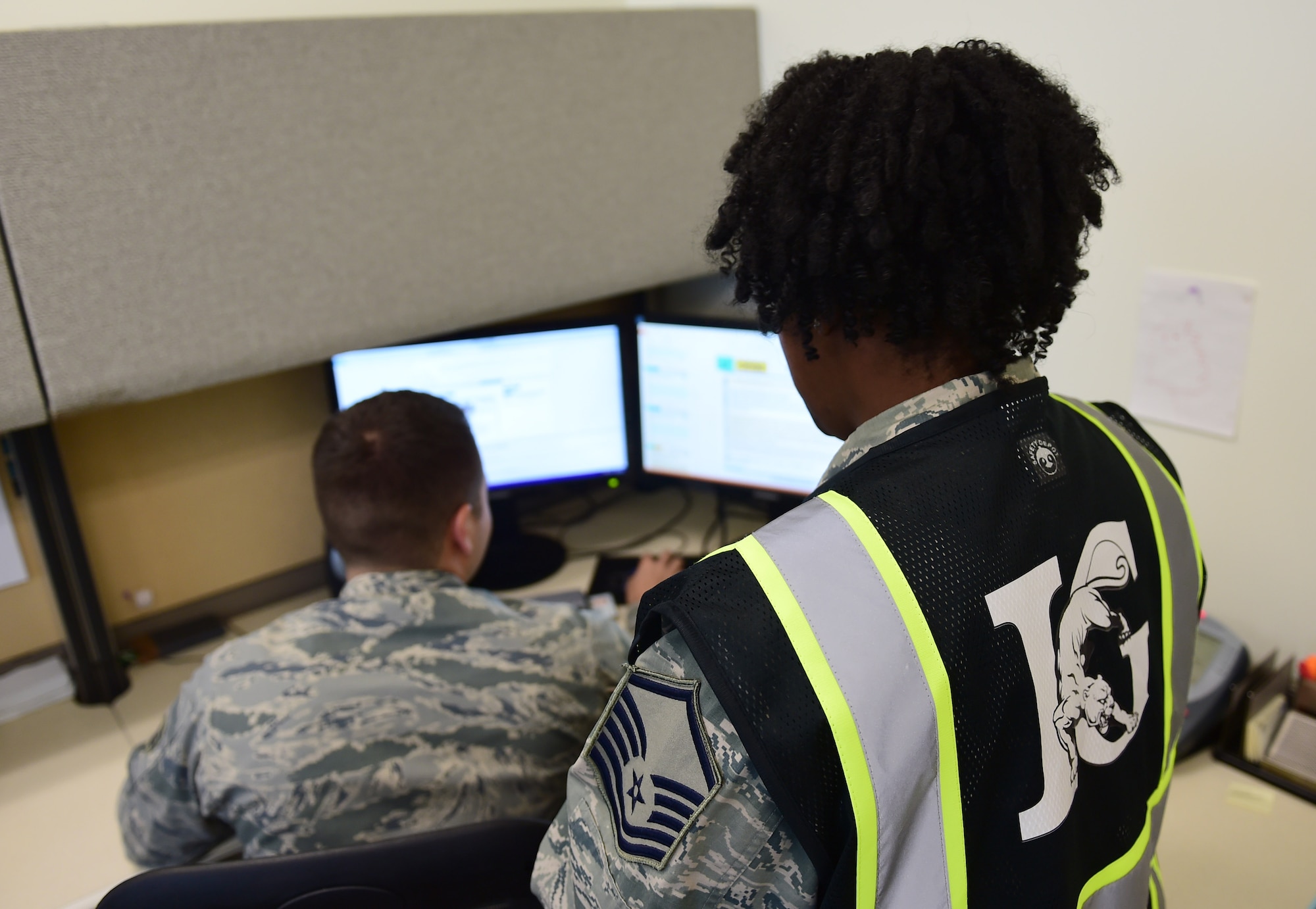 Master Sgt. Lacey Ranson, 460th Space Wing Inspector General superintendent, simulates a computer-based inspection with Staff Sgt. Mitchell Montepagano, 460th SW IG Self-Assessment Program/Management Internal Control Tool manager Nov. 29, 2016, on Buckley Air Force Base, Colo. Inspections ensure installation readiness and provide feedback to the commander on proficiency and deficiencies throughout the base. (U.S. Air Force photo by Airman Jacob Deatherage/Released)