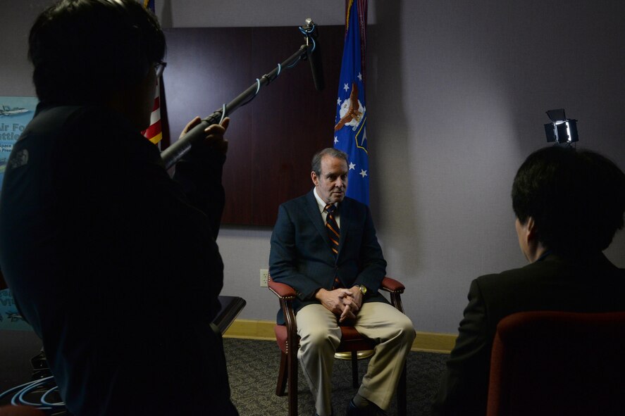 Dr. Daniel Haulman, Air Force Historical Research Agency Chief of Organization Histories Branch, sits through an interview with the Japanese Broadcasting Corporation, Nippon Hoso Kyokai documentary crew, Dec. 5, 2016, Maxwell Air Force Base, Ala. The interview with Dr. Haulman focused heavily on the WWII bombings of Japan and Europe. (U.S. Air Force photo/Senior Airman Alexa Culbert)