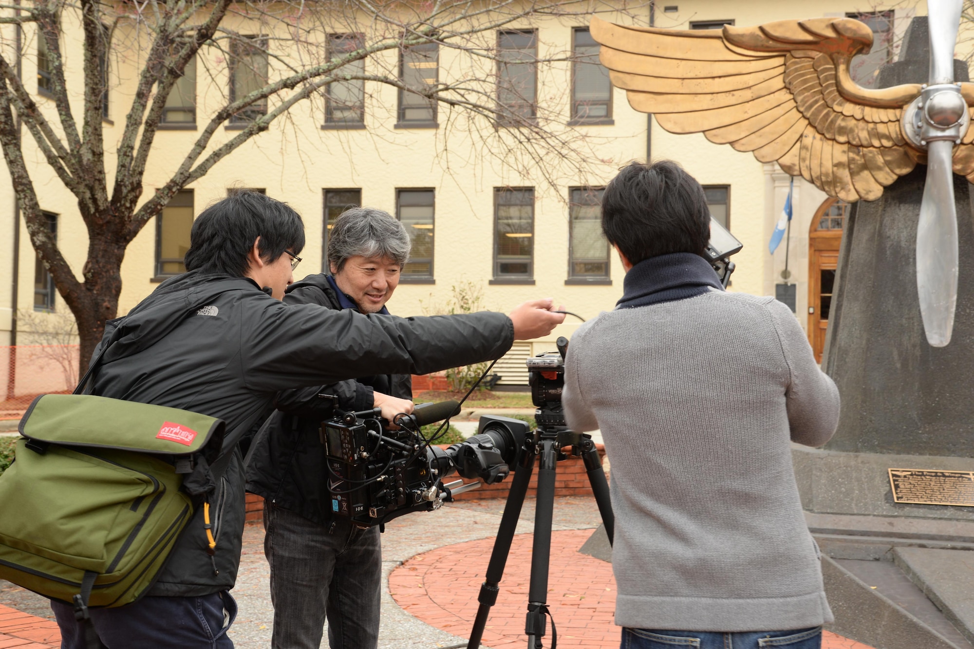 A documentary film crew from the Japanese Broadcasting Corporation, Nippon Hoso Kyokai films the Air University prop and wings for their upcoming documentary, Dec. 5, 2016, Maxwell Air Force Base, Ala. The film crew has been working on this documentary for 18 months and has traveled across the U.S. to gather more information on the men and women of WWII who helped save salvage priceless monuments and works of art in Europe and Asia. (U.S. Air Force photo/Senior Airman Alexa Culbert)